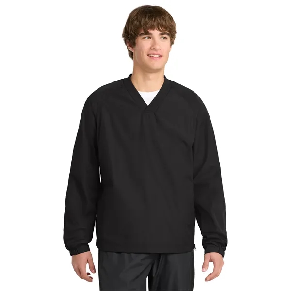 Sport-Tek V-Neck Raglan Wind Shirt.