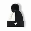 Color-blocked fleece-lined knit hat with pom-poms