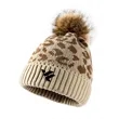 Leopard print rolled-edge pom-pom knit hat